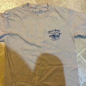 Beige shirt with blue accents